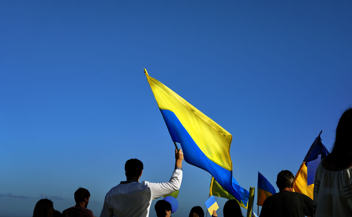 Supporters of Ukraine holding the nation's blue and yellow flag. 